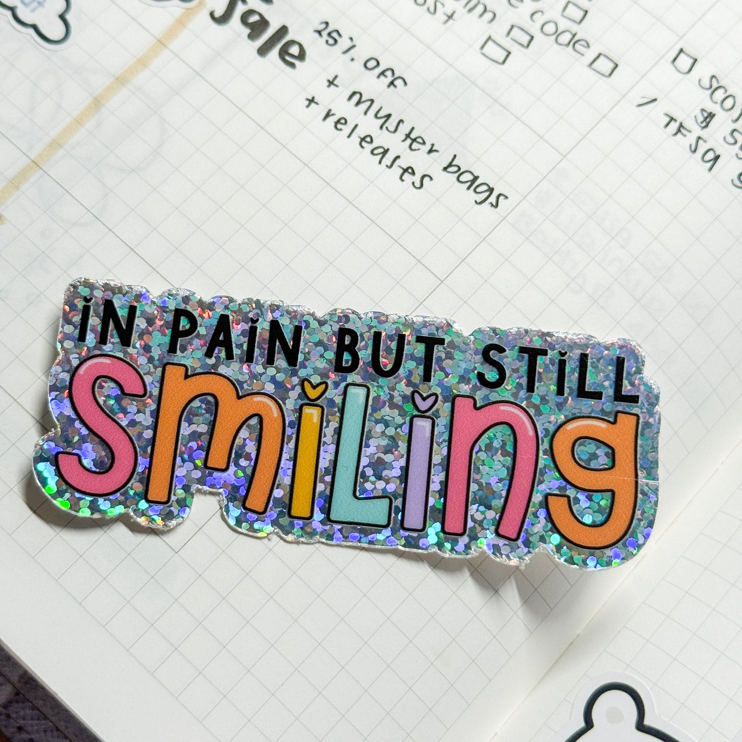 In Pain But Smiling Vinyl Die Cut Sticker | Holographic Glitter