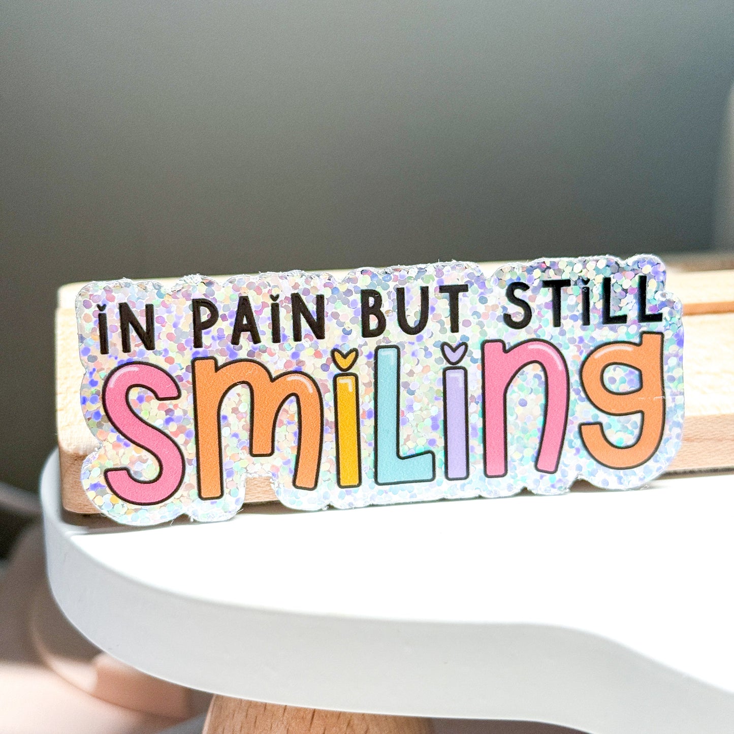 In Pain But Smiling Vinyl Die Cut Sticker | Holographic Glitter