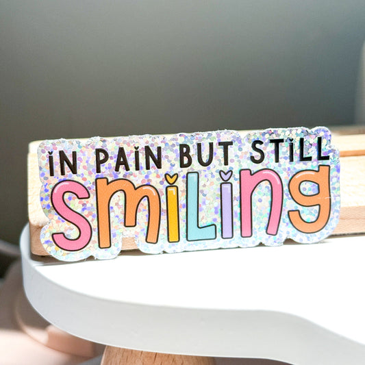 In Pain But Smiling Vinyl Die Cut Sticker | Holographic Glitter