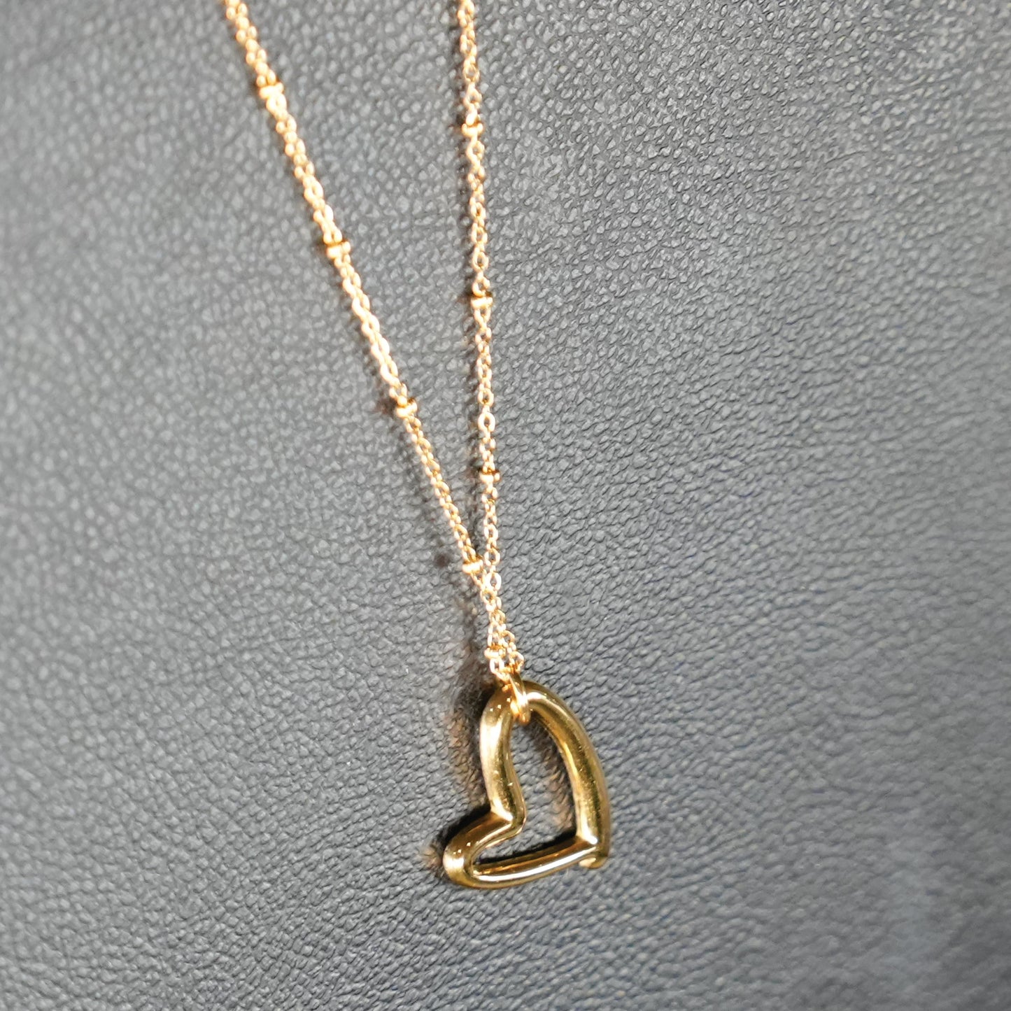 Dainty Beaded Chain Anchoring an Abstract Heart Shaped Pendant