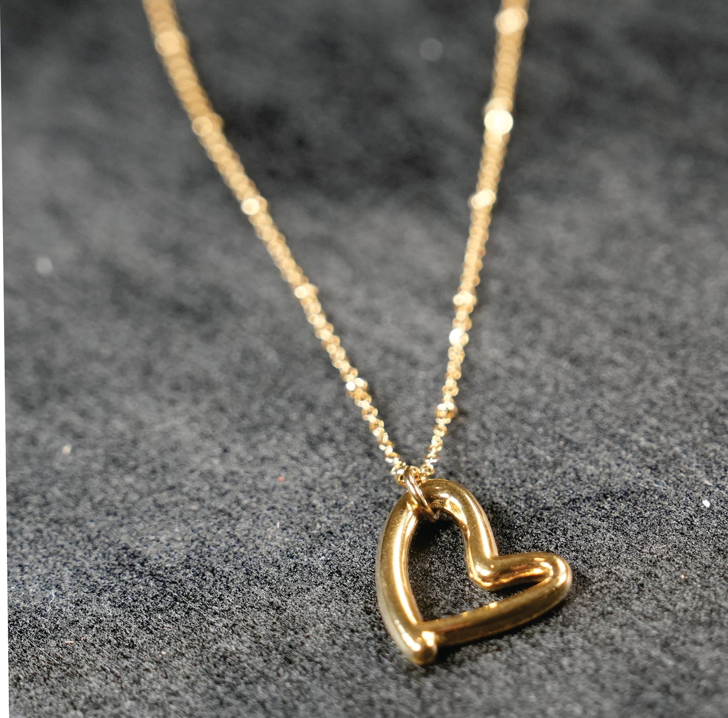 Dainty Beaded Chain Anchoring an Abstract Heart Shaped Pendant