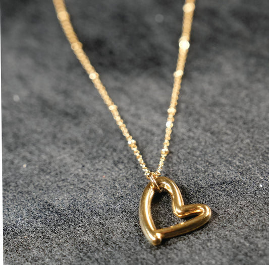 Dainty Beaded Chain Anchoring an Abstract Heart Shaped Pendant